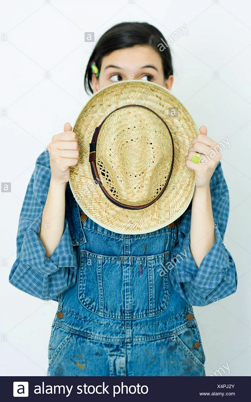 Girl pulling hat over face